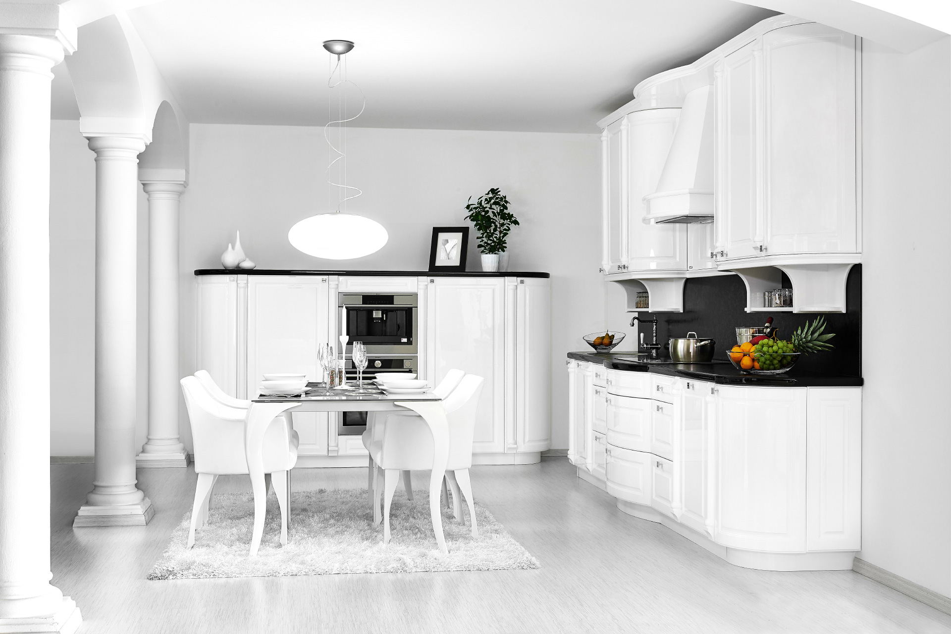 Rustic Hanák kitchen in white gloss combined with a black worktop.